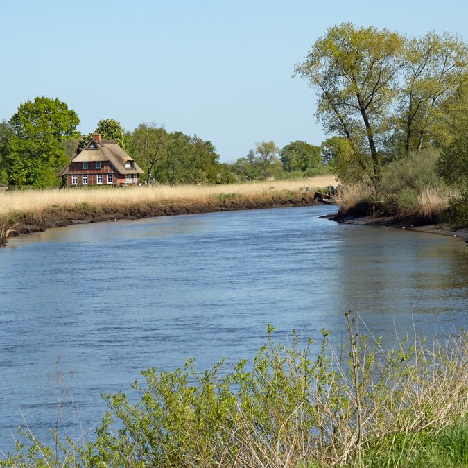 Traditional house on the River Wümme in the countryside of Blockland, a district of the city of Bremen